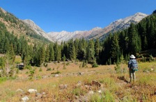 The East Eagle Creek Trail is through a U-shaped glaciated valley, beneath colorful alpine peaks.