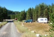 The North Fork John Day Campground is on a pine-covered bench next to the highway.