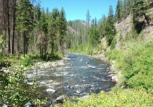 Within the Wilderness Area, the North Fork John Day River flows through a narrow, rocky canyon.