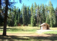 The Timothy Springs Campground is a rustic site, with an historical guard station (at rear).